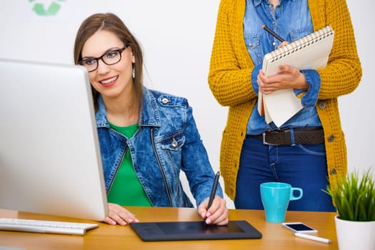 Women working at desk In a creative office, team work