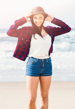 Portrtait of a happy girl at the beach enjoying the life