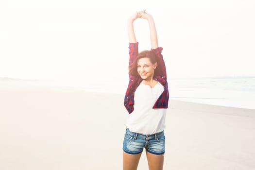 Portrtait of a happy girl at the beach enjoying the life