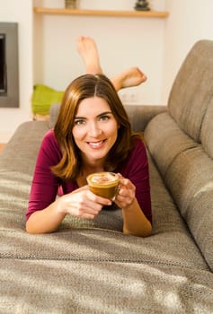 Beautiful woman at home Having a good time with cup a coffee
