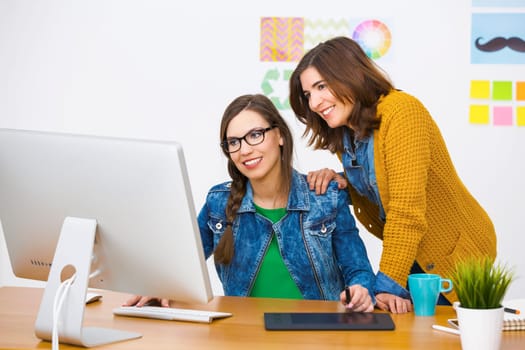 Women working at desk In a creative office, team work