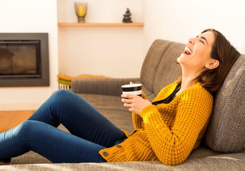 Beautiful woman at home Having a good time with cup a coffee