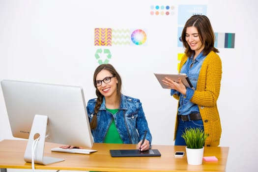 Women working at desk In a creative office, team work