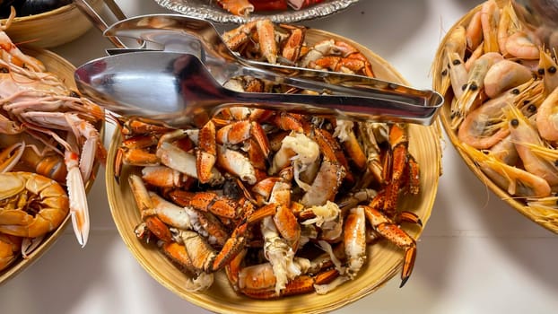 Shrimp and prawns in a bowl on a buffet.