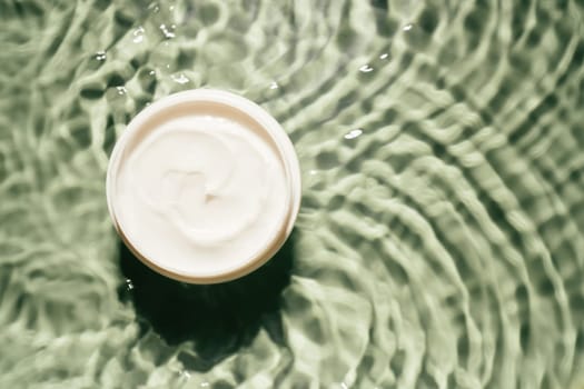 White plastic jar pot of facial and body cream gel collagen for anti aging wrinkles treatment. Water waving rippled. Professional spa relaxation moisturizer, healthy skin care. Flat lay, copy space.