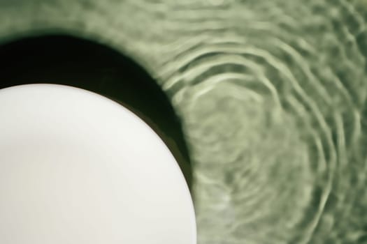 White circle copy space in transparent fresh green blue water drop splashing gel surface with flecks, waves, shade. Health care relaxation. Vacation coast sea natural concept. Flat lay. Place for text