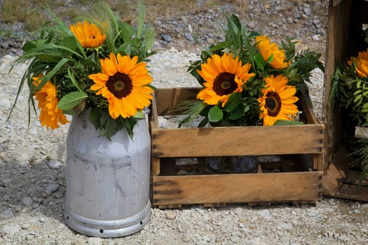 A festive decoration with beautiful yellow sunflowers.
