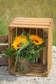A festive decoration with beautiful yellow sunflowers.