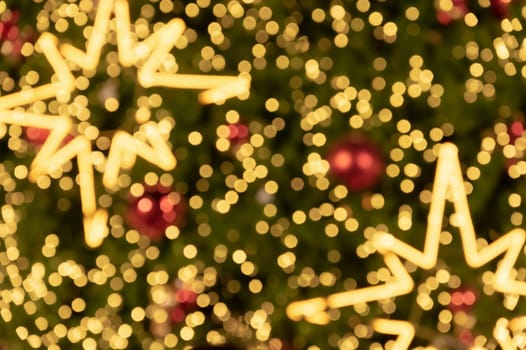 Blur bokeh background of star shaped Christmas tree lights