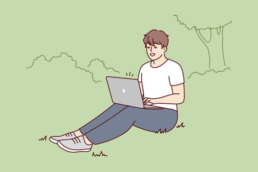 Smiling young man sit on ground in park working on laptop. Happy male freelance type on computer outdoors. Remote job or education. Vector illustration.