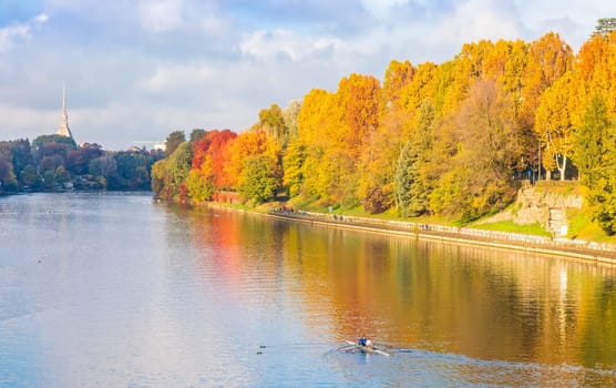 Turin, Piedmont Region, Italy - Circa November 2021: landscape in autumn with Po' river and blue sky.