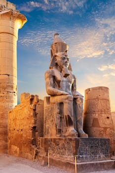 Statue of Ramesses seated by the Luxor Temple entrance, Egypt.