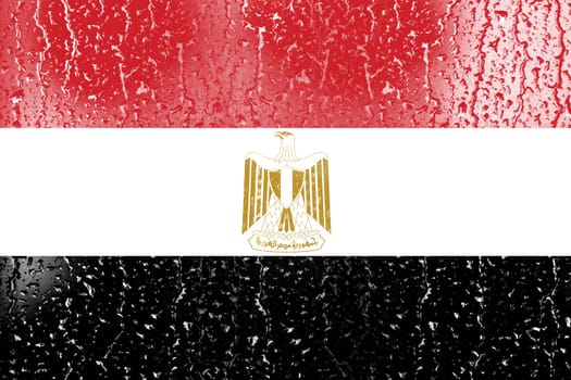 3D Flag of Egypt on a glass with water drop background.