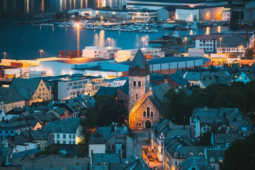 Alesund, Norway. Night View Of  Alesund Skyline Cityscape. Historical Center In Summer Evening. Famous Norwegian Landmark And Popular Destination. Alesund, Kiven viewpoint, Mt. Old Alesund Church.