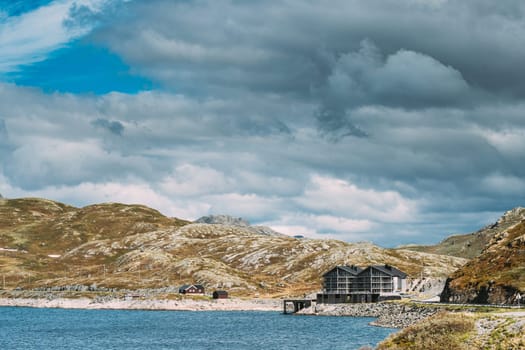 Oppland, Tyin Lake, Norway. Stones On Coast Of Beautiful Lake Tyin In Summer Cloudy Day. Norwegian Nature.