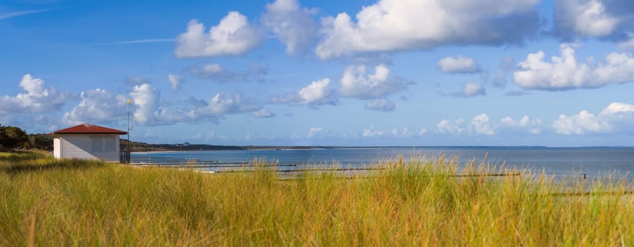 dreamlike, empty baltic sea beach on the island Usedom near Zinnowitz with blue sky