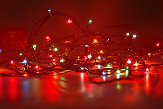 Christmas garland on a dark background. Concept of christmas, new year. Blurred background, out of focus.