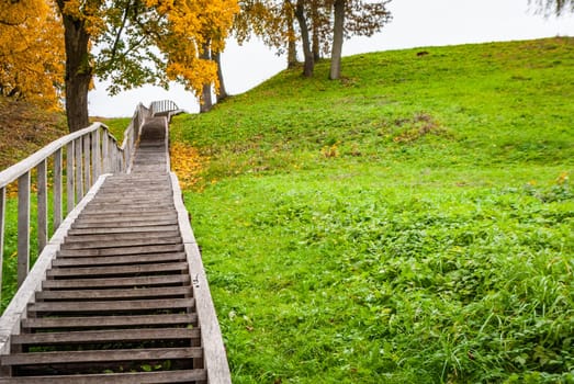 Wooden staircase leading to a hill in Dubingiai, Lithuania.