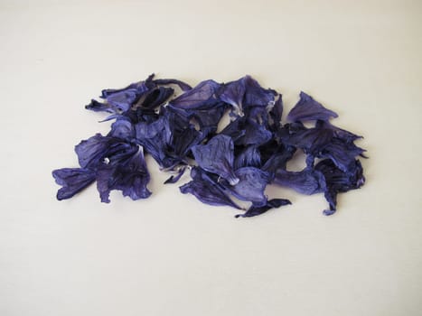 Dried mallow flowers on a wooden board