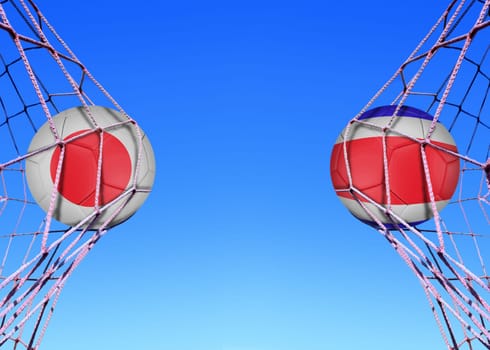 Two soccer balls in flags Japan and Costa Rica in a net