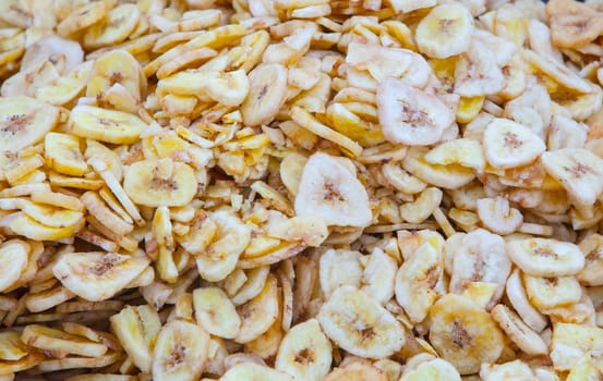 Dried banana fruit slices. Product displayed at street market stall
