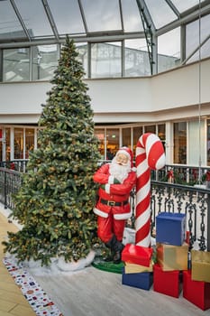Dublin, November 2019 Santa Claus, Christmas tree and gifts or presents as decoration in Arnotts Shopping centre on Henry Street