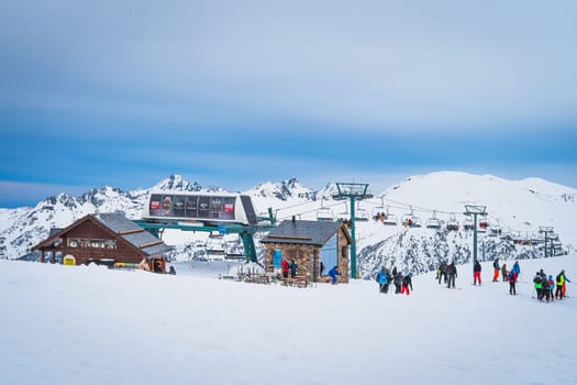 El Tarter, Andorra, January 2020 Group of people, skiers and snowboarders taking of from ski lift on the top of Pyrenees Mountains, Grandvalira