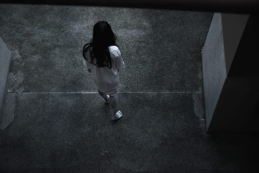 Back woman ghost horror under building house, halloween concept