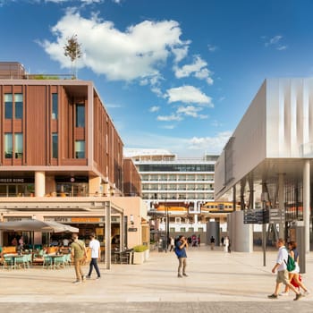 Istanbul, Turkey - August 31, 2022: Internal passage at Galataport, a mixed use development located along shore of Bosphorus strait, in Karakoy district, with docked huge cruise ship in the background