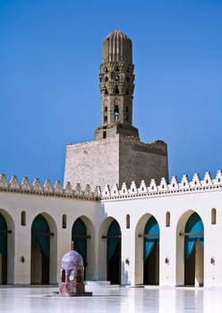 Cairo, Egypt - September 28 2012: Minaret of Al Hakem Mosque (The Enlightened Mosque) , located in Muizz Street, south of Bab Al-Futuh (one of the doors of old Cairo city)