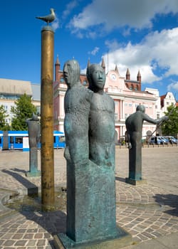 town hall rostock germany with well in foreground