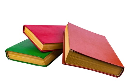A stack of old books with colored covers. Books for reading. Old book. Book page of yellow paper. White background. Paper product. Read literature. Background picture.