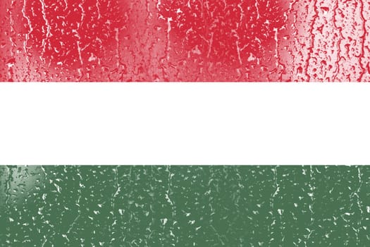 3D Flag of Hungary on a glass with water drop background.