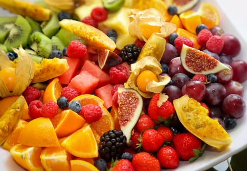 A colorful fruit salad in a bowl. Fruit of the most diverse types and varieties.