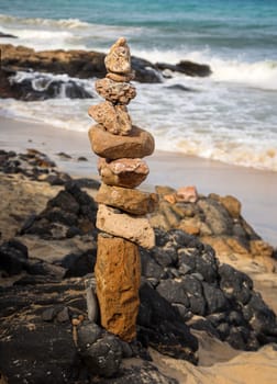 Many stones balancing as a pyramid, stacked on top of each other.