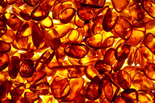 Well illuminated stones of amber which are cut.