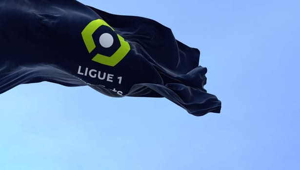 Paris, FRA, July 2022: Close-up of the Ligue 1 flag waving in the wind. Ligue 1 is a French professional league for men association football clubs. Illustrative editorial