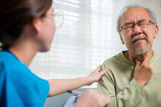 Doctor woman examines lymph nodes on elderly neck to determine if swollen, sore throat, Asian young nurse checking senior old man neck pain in clinic at retirement home, physical therapist
