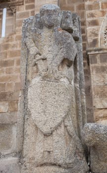 Knight of Alcantara stone effigy at Church of Santa Maria de Almocovar main doorway, Alcantara, Caceres, Extremadura, Spain