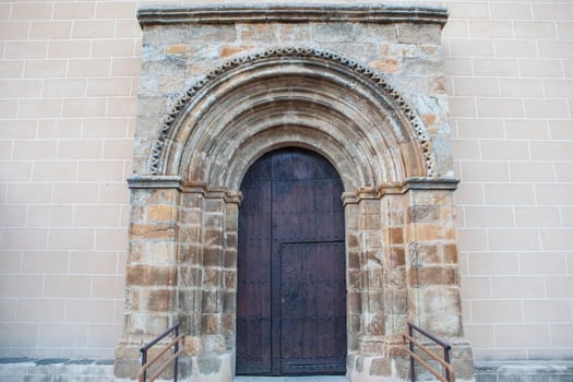 Church of Santa Maria de Almocovar, Alcantara, Caceres, Extremadura, Spain. Side romanesque doorway