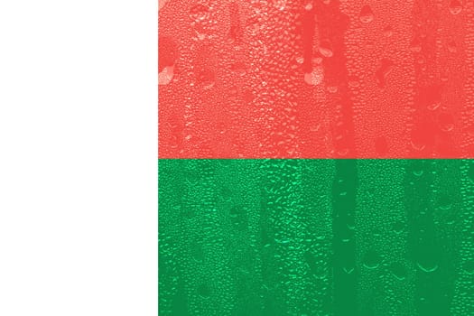 3D Flag of Madagascar on a glass with water drop background.