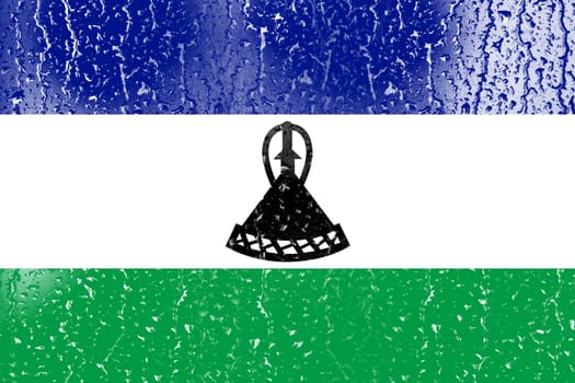 3D Flag of Lesotho on a glass with water drop background.