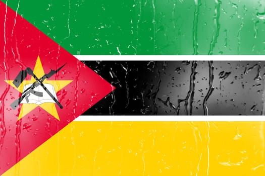 3D Flag of Mozambique on a glass with water drop background.