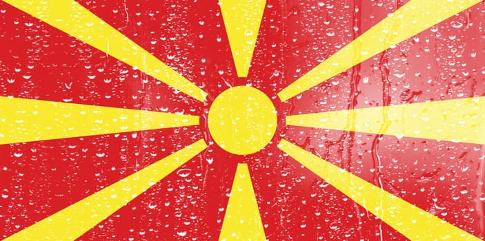 3D Flag of North Macedonia on a glass with water drop background.