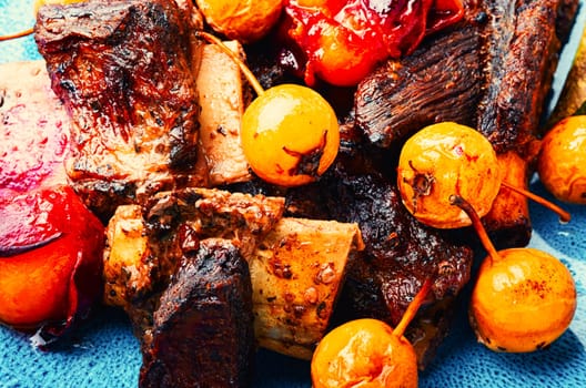 Prepared pork ribs fried with autumn fruit.Spare ribs on the plate