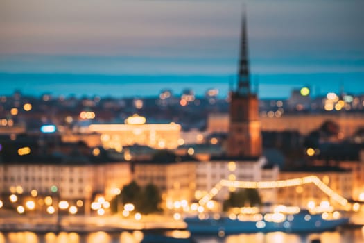 Stockholm, Sweden. Night Skyline Abstract Boke Bokeh Background. Design Backdrop. Riddarholm Church In Night Lighting