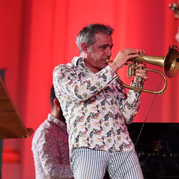 Cracow, Poland - July 4, 2022: Adam Baldych Quartet and Paolo Fresu live on stage of  Krakow Philharmonic at Summer Jazz Festival in Cracow, Poland