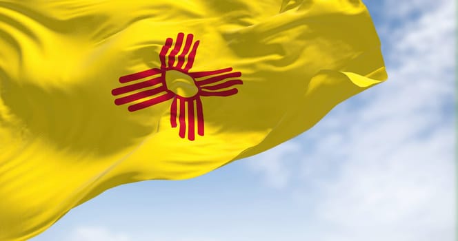 Flag of New Mexico state waving in the wind on a clear day. New Mexico is a federated state in the southwestern United States. Us state flag. 3D render