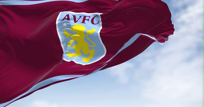Birmingham, UK, May 2022: The flag of Aston Villa Football Club waving in the wind on a clear day. Aston Villa is a professional football club based in Aston, Birmingham, England