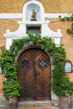 Old vintage wooden door in Hallstatt in Austria
